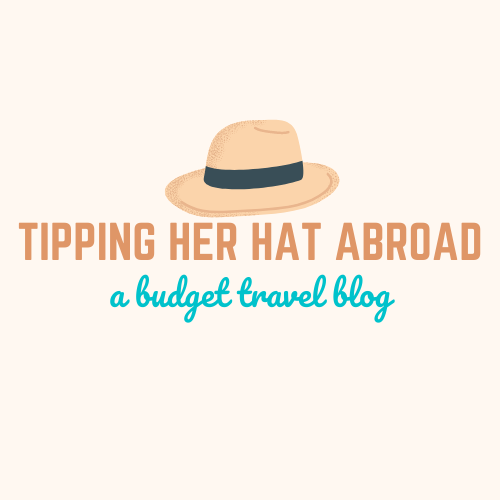 Tipping Her Hat Abroad Logo